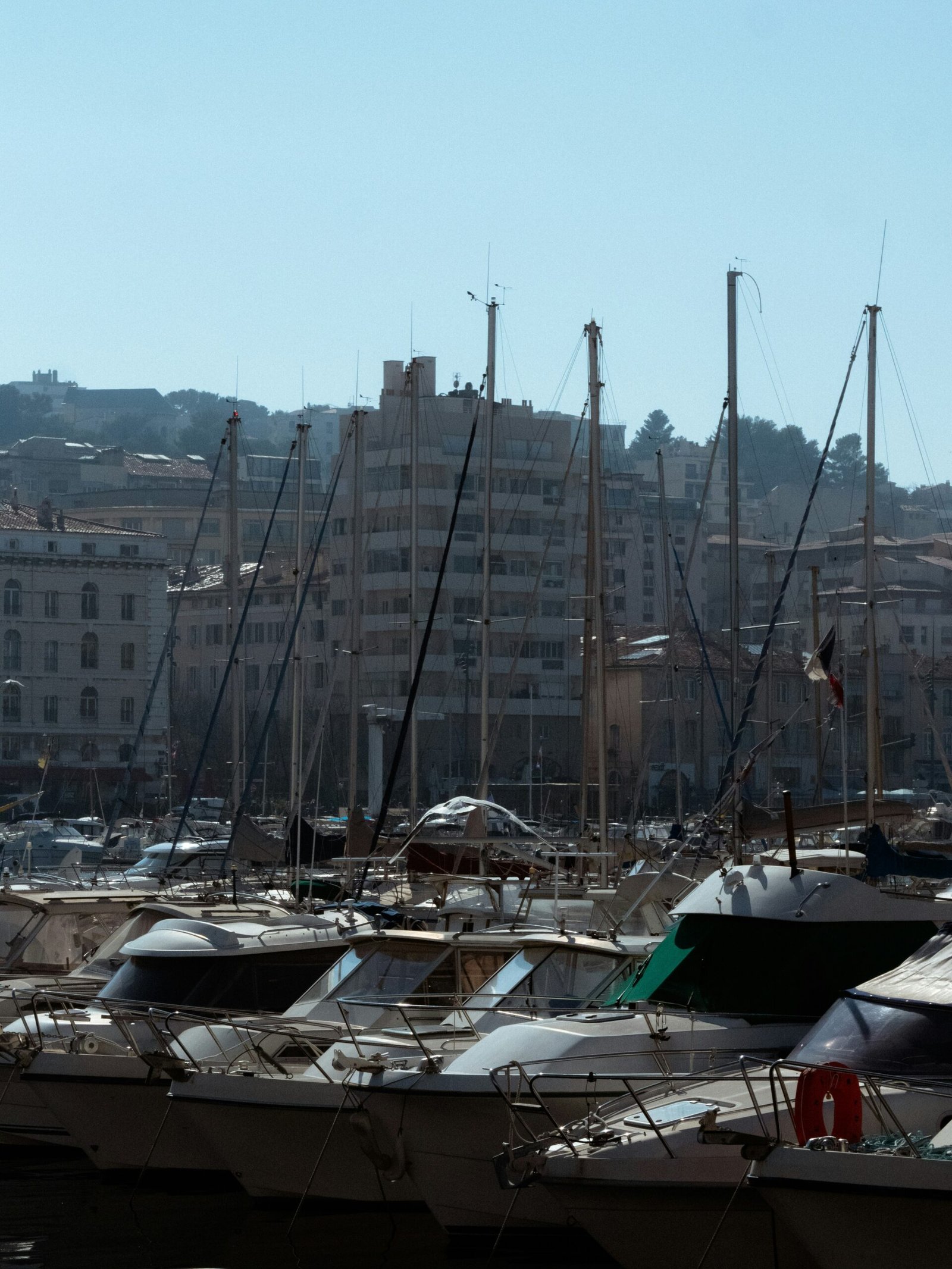 Happy family or professionals arriving in Marseille with the Vieux Port in background