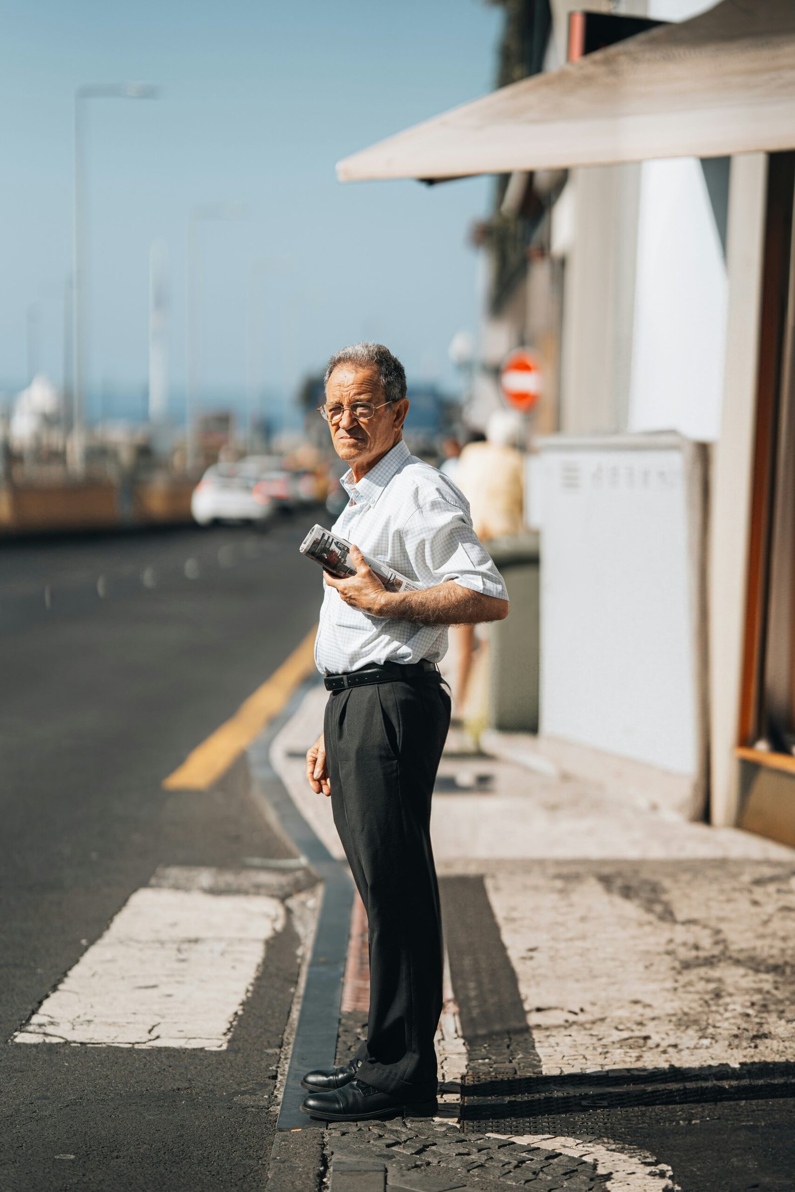 Business man checking documents near a fleet car