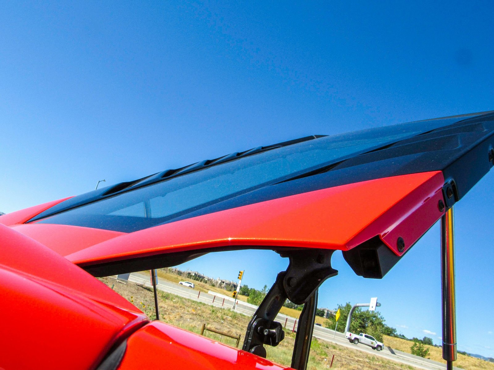 Side-by-side comparison chart graphic showing durability of different windshield treatments: cheap spray (1 month), standard sealant (6 months), professional ceramic coating (12+ months).