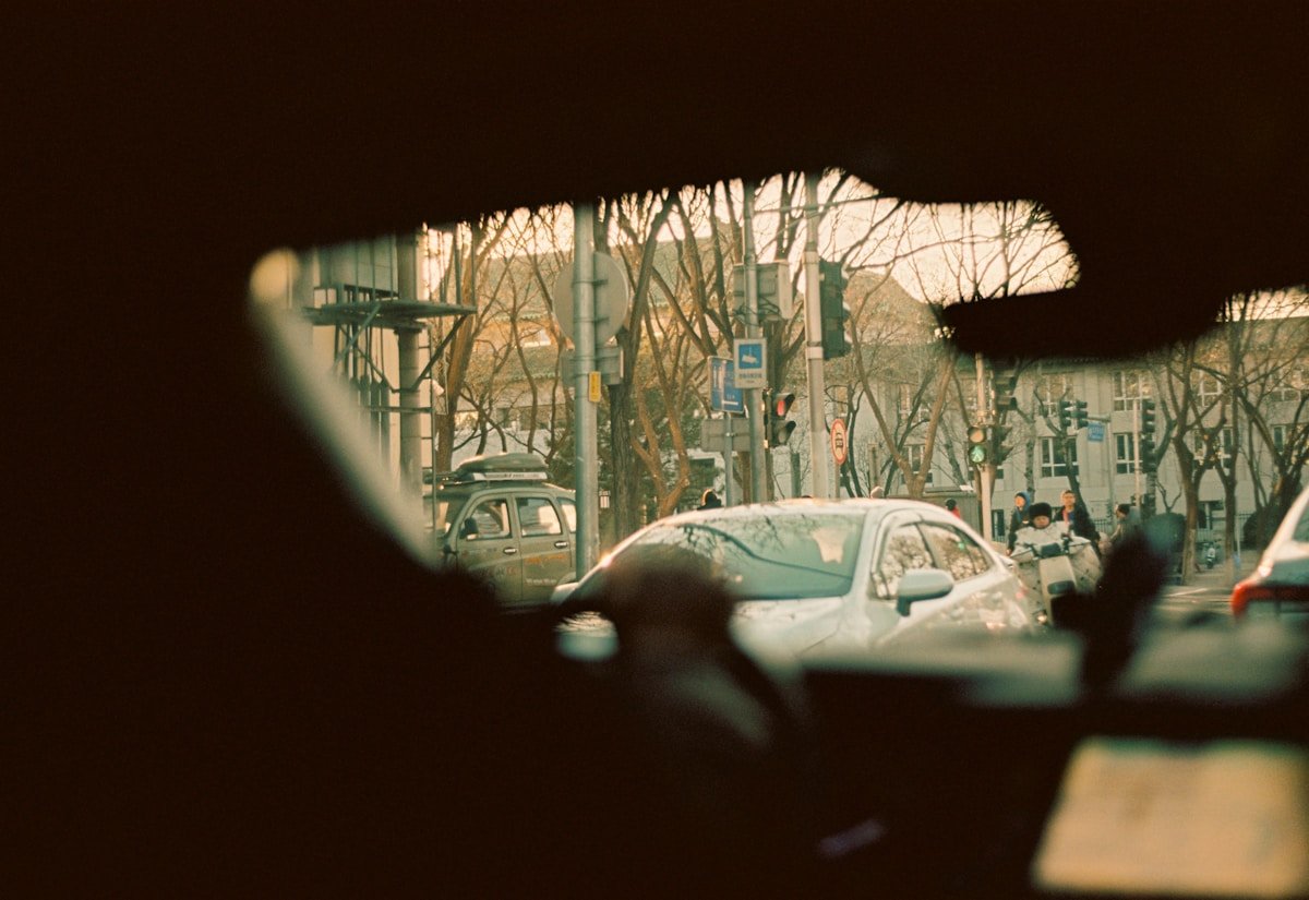 a view of a busy street from inside a car