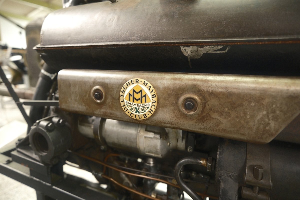 Close-up of an old engine with its emblem.