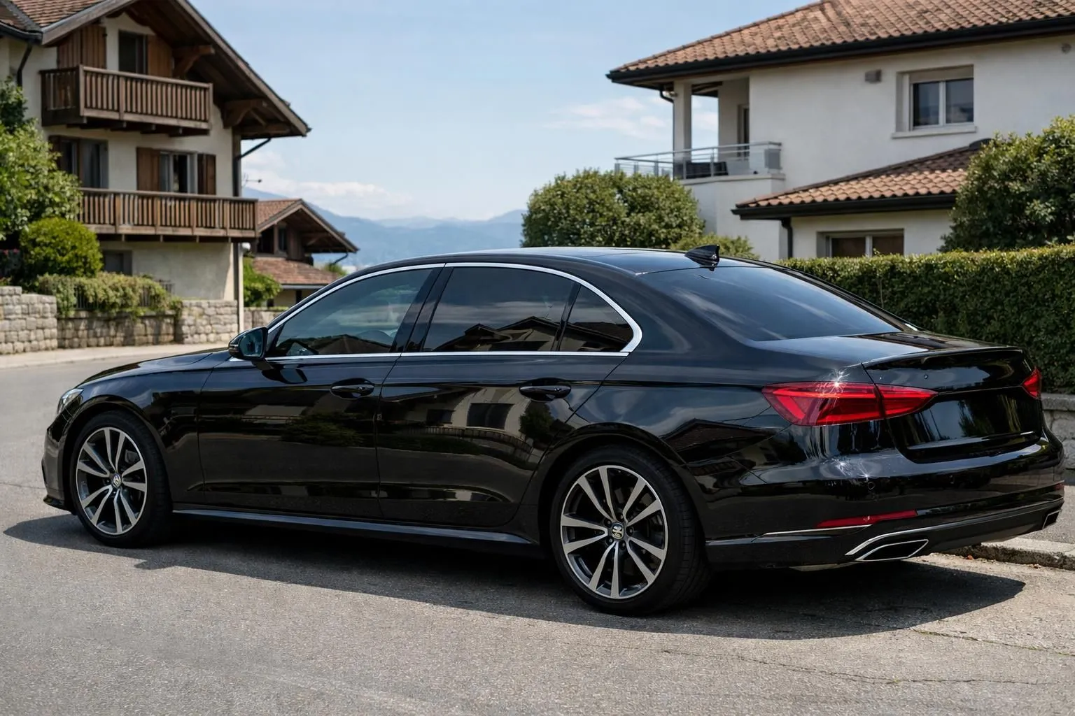 Luxury sedan with dark tinted windows parked in modern Swiss neighborhood near Lausanne, showcasing elegant black tinted glass reflecting surrounding buildings, professional installation visible on all side windows, Swiss residential architecture in background, natural daylight showing subtle window film quality