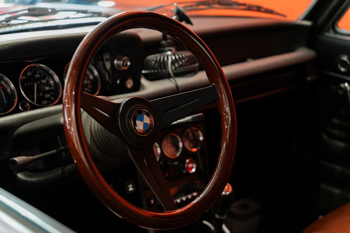 a steering wheel and dashboard of a car