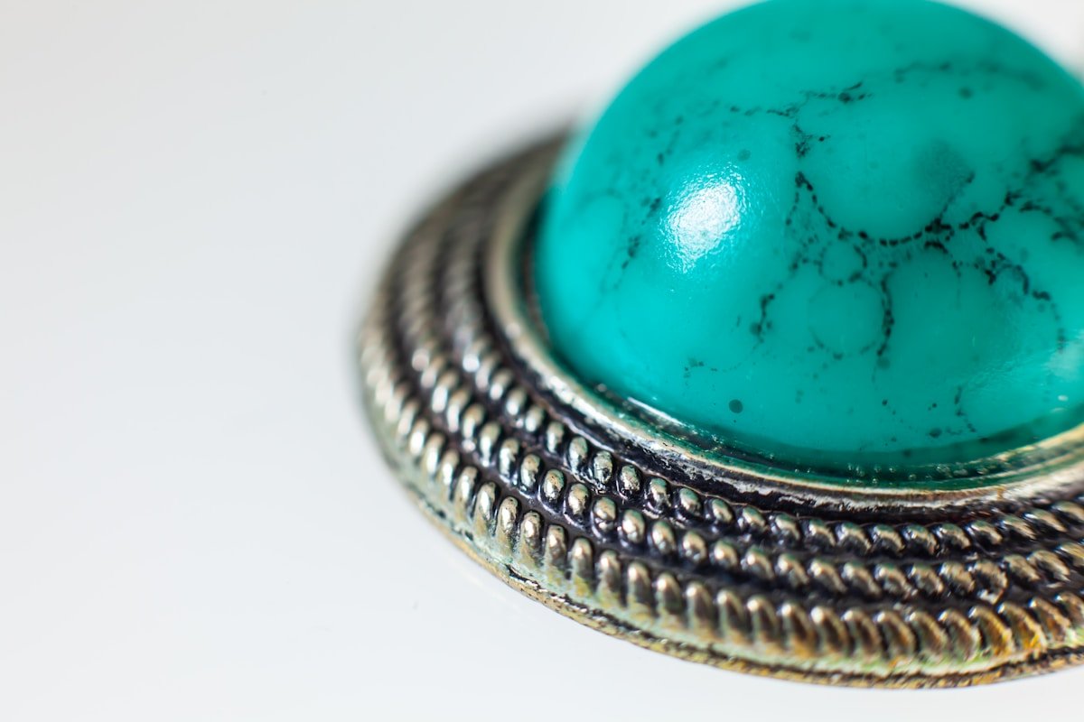 a green and blue glass ball