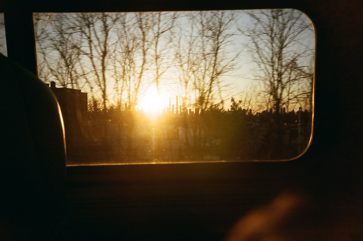 A view of the sun through a car window