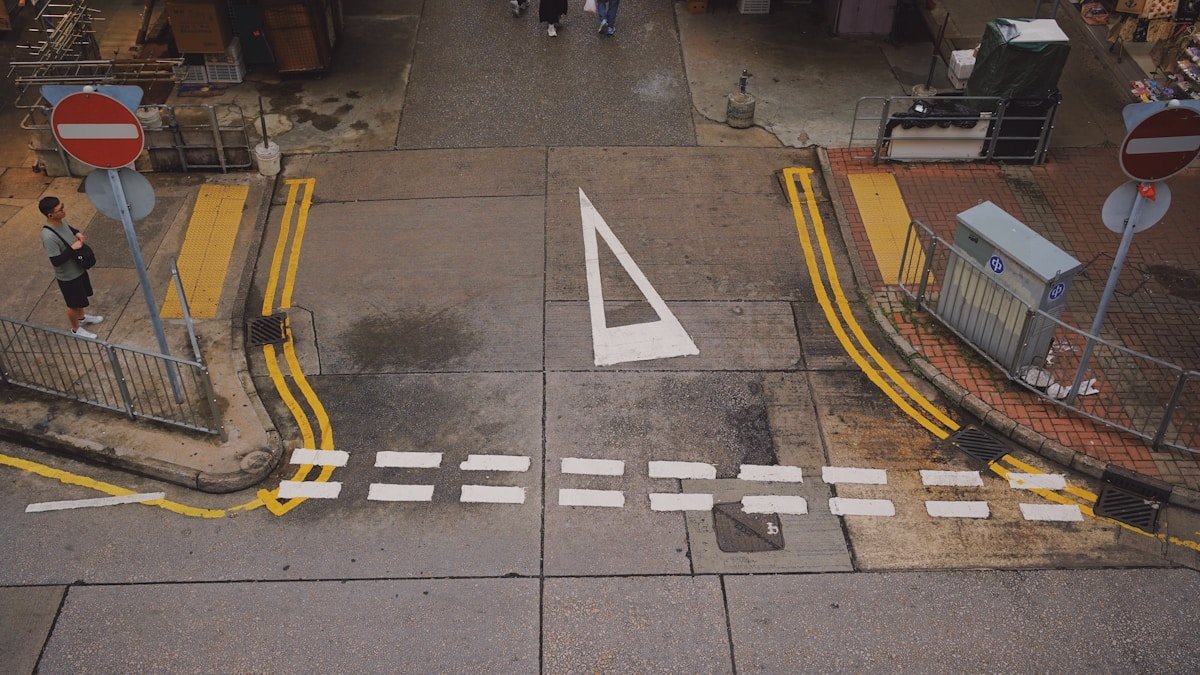 an overhead view of a street with a pedestrian crossing